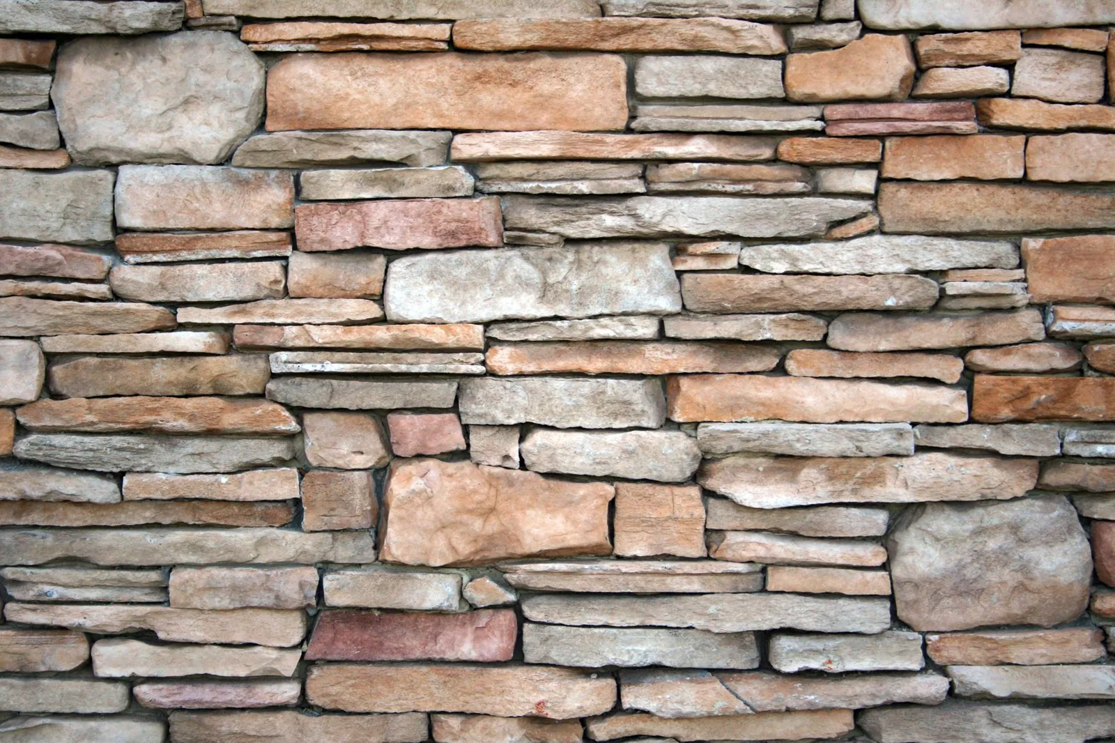 Stone veneer vs brick veneer cost comparison showing natural stone wall texture