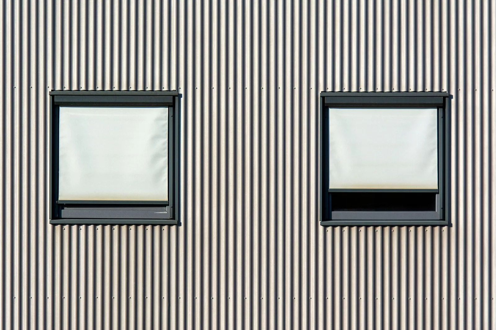 Corrugated metal siding on a minimalist modern home facade
